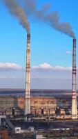 Aerial view of factory polluted ecology. Environmental global warming atmosphere. Full length view Vertical video