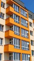 Construction of a modern building in the city. Facade of multistory apartment house with plastic windows in the city. Building of a new architecture concept video