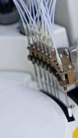 Advanced equipment carrying science testing in the modern laboratory. Close up. View from top. Blurred backdrop. Vertical video