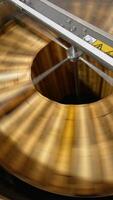 Opened lid to a metal barrel machine for honey extraction. Frames with honeycombs are rotated in the centrifuge apparatus. Top view. Vertical video