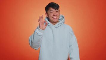 Man looking approvingly, showing ok approve feedback gesture like sign positive something good video