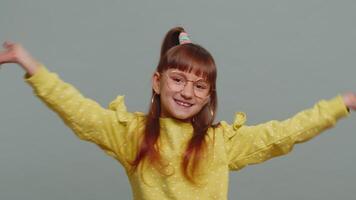 Toddler girl child appear from below waving hi with her palm greeting with hospitable friendly smile video