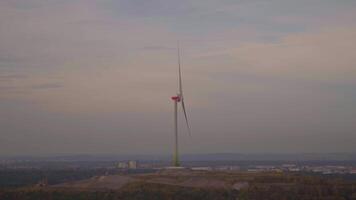 Ecological source of energy. Zipline Frottmaninger Berg. Turbine Frottmaninger Mullberg. Windmill in Muenchen at sunset. Renewable energy concept. Wind power plant in Bavaria. Windmill propeller. video