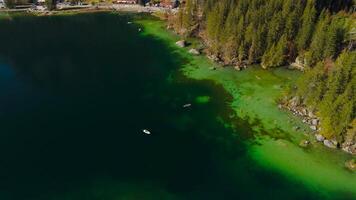 Hintersee in Ramsau, Germany, captured from above in autumn, reveals turquoise waters, the Ramsauer Ache, majestic Alps, and the enchanting Magic Forest. Enjoy boat rentals on this serene lake. video