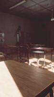 View to classroom with tables and small blackboard and grungy walls video