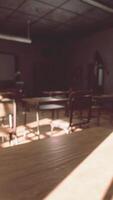 View to classroom with tables and small blackboard and grungy walls video