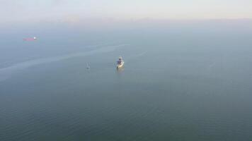 The luxury yacht NORD is anchored in the Amur Bay at dawn. Drone view video