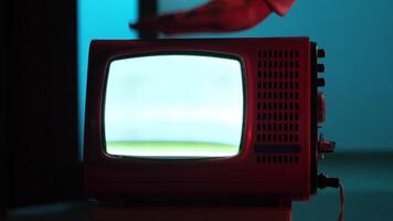 Angry man banging on TV trying to tune it. Lost TV signal. White noise on TV screen video