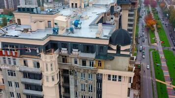 Construction of a tall building in the city. Modern block of flats builds in the city. New tower architecture with windows. Aerial view. video