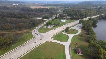 An aerial view of a highway intersection with a lake in the background video