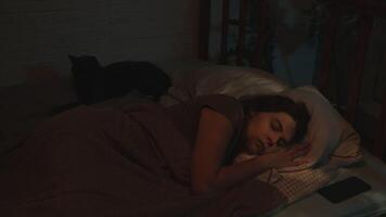 Insomnia. Sleepless and anxious woman tossing and turning lying awake on bed at night video