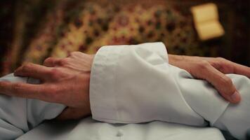 Man Praying On Carpet For Ramadan Overhead View video