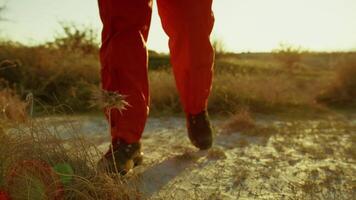 An Astronaut in an Orange Suit Smell a Poisonous Flower on Hostile Planet video