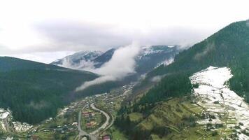 Mountain village, top of view to small houses, high-altitude view, mountain view, charming village, pastoral rustic village atmosphere, breathtaking view, small village video