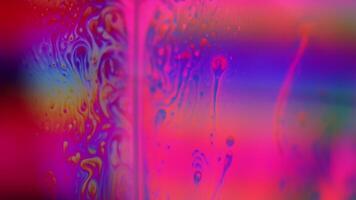 Multicoloured fluid forms, liquid surface, colour waves, deep dark backgrounds, dynamic liquid movement, multicoloured surface video