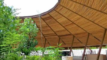 Wooden building with an open circle in ceiling sky view. video