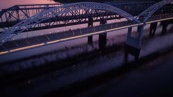 Vertical view from top down. Flying over the road bridge in the late evening video