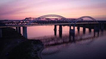 Vertical view from top down. Flying over the road bridge in the late eveni video
