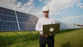 Engineer analyzing solar panel data in renewable energy field video