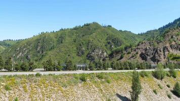 Panoramic view over landscape and mountains. Mountain highway and cable railway in Almaty video