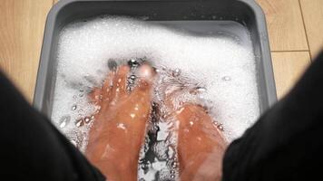 Enjoy a Relaxing Foot Soak in Bubbles for Ultimate Comfort and Rejuvenation video