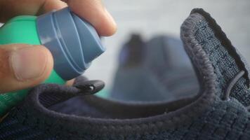 Closeup of Spraying shoe freshener video