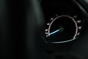 Close up shot of a speedometer in a car. At an engine speed of 1800 rpm on Car dashboard photo