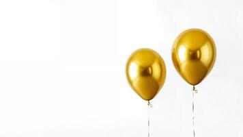 Two shiny gold balloons on white background. photo