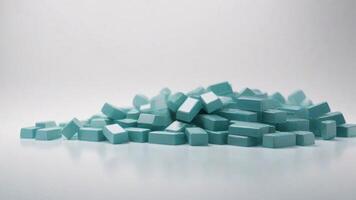 Teal rectangular blocks pile on white background. photo