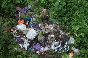 garbage and trash are scattered on the ground photo