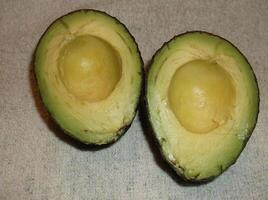 An avocado with the pit removed. photo