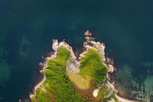 View from a drone vertically down on the rocks of Cape Kuzmin photo