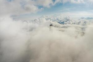 Aerial view of the top of the pylons of the Russian bridge in clouds photo