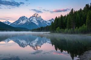 the grand teton mountains are reflected in the water photo