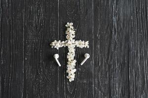 Spring flowers in the shape of a cross. The concept of Christian music. photo
