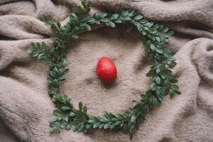 Easter decoration featuring colorful eggs arranged in a cozy nest photo