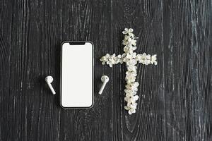 Spring flowers in the shape of a cross. The concept of Christian music. photo