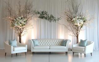 A sophisticated seating arrangement features a white tufted sofa and two matching chairs decorated with soft pillows photo