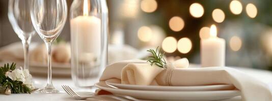 A beautifully arranged table features plates and glasses surrounded by soft candlelight and sprigs of greenery, creating a warm and inviting atmosphere for dining photo
