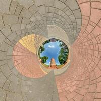 blue sphere inside overlooking town, development, historic buildings surrounded by a frame of paving slabs. Transformation of spherical 360 panorama in abstract aerial view. photo