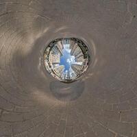 inside overlooking old town, urban development, historic buildings surrounded by a frame of paving slabs. Transformation of spherical 360 panorama in abstract aerial view. photo