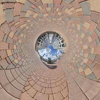 development, historic buildings surrounded by a frame of paving slabs. Transformation of spherical 360 panorama in abstract aerial view. photo