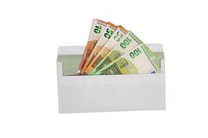 White envelope with 10 ,50 and 100 Euro banknotes isolated on a white background. Top view photo