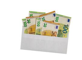 Euro money, in banknotes of 100 an 50 denominations, coming out of the envelope on white background.The concept of salary, bribe, loan, debt, win photo
