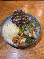 Salad platter with mash potato and chicken photo