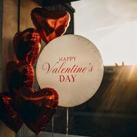 Charming Valentine's Day image featuring a radiant white balloon with 'Happy Valentine's Day' text, photo