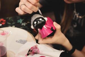 Join us for an engaging and creative painting session that features whimsical figurine designs photo