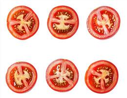 Six slices of tomatoes are arranged in a grid, showcasing their juicy, seed-filled centers against a white background. The textures and vibrant red color are prominent photo