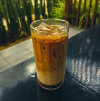 Close up to Iced Latte Coffee on table photo