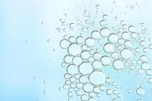 Delicate light blue abstract background with numerous air bubbles floating in a soft gradient. Copy space photo